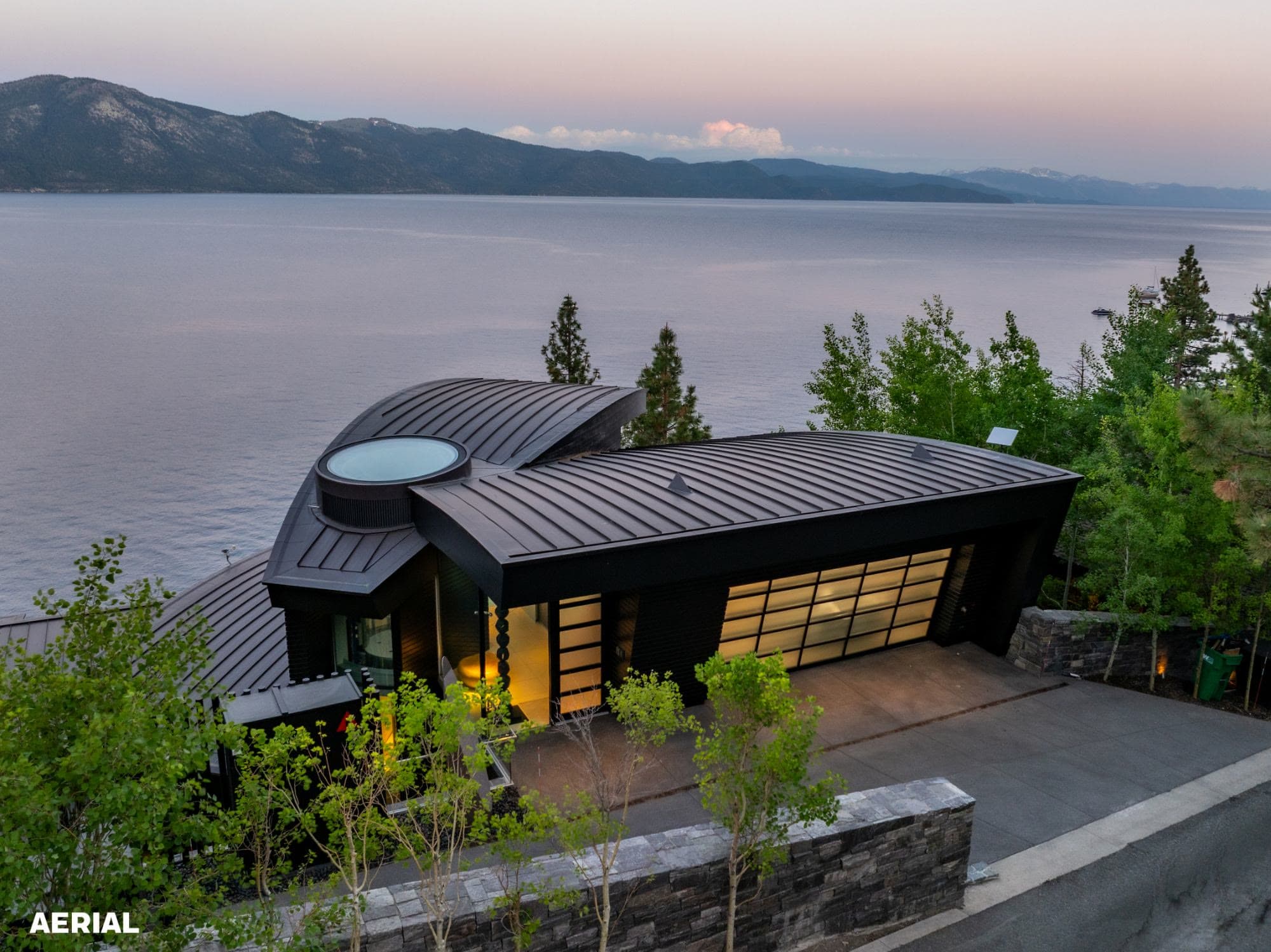 Lakefront home at dusk, from above