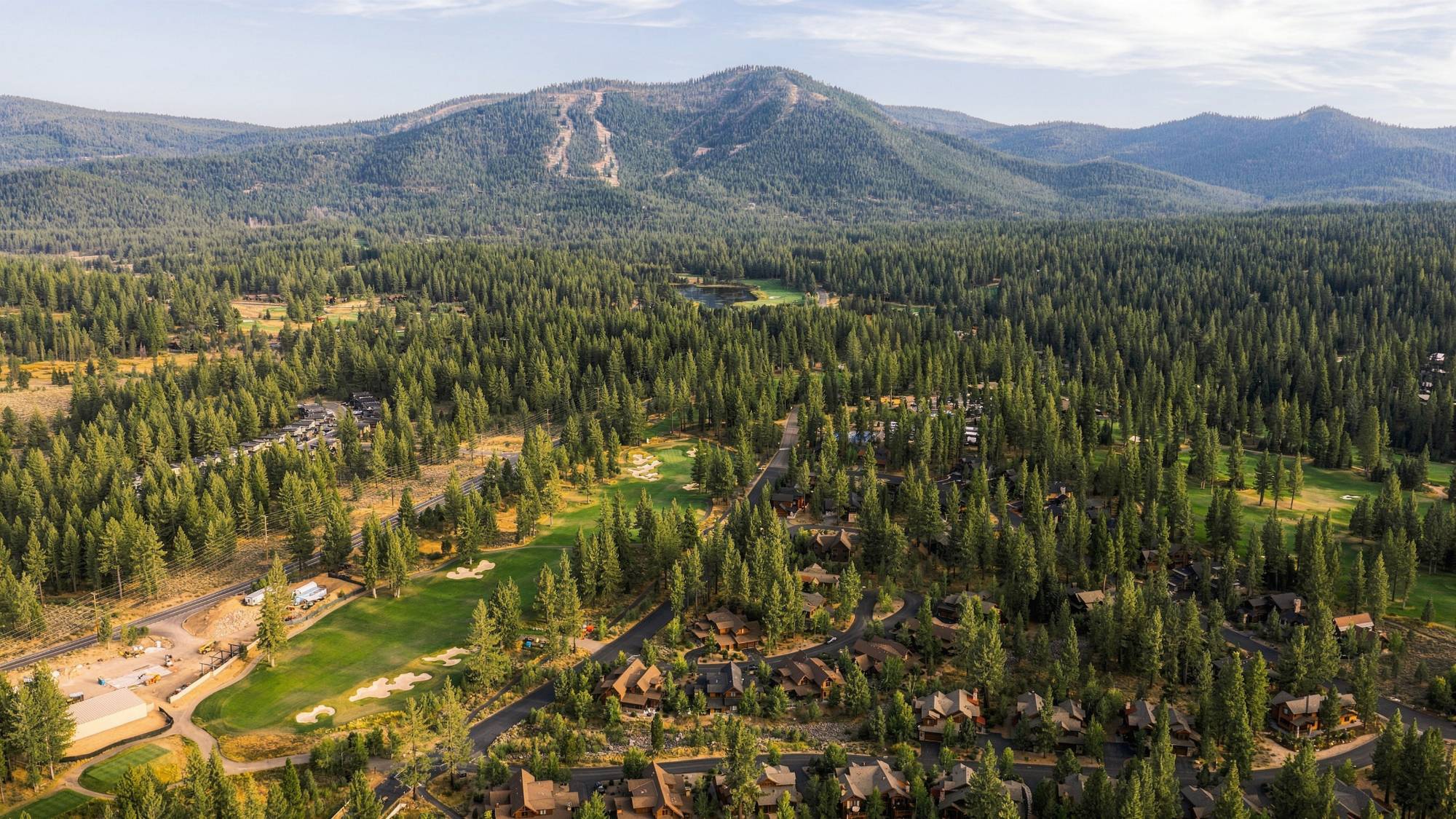 Aerial photograph of a mountain home by The Visaro