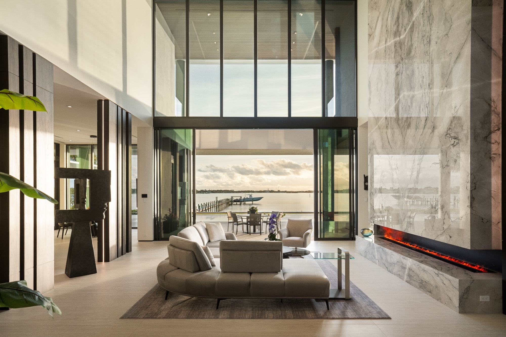 Living room opening to the water, photographed by The Visaro